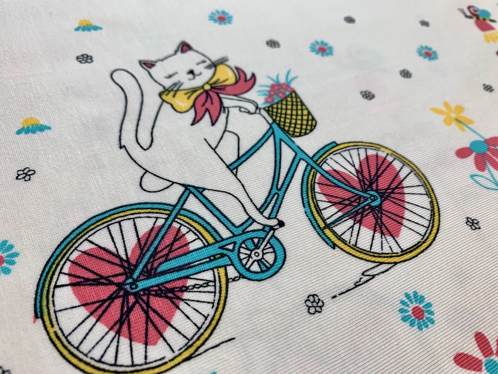 Jersey - Panel Bordüre Katze auf Fahrrad - Meterware (10cm)